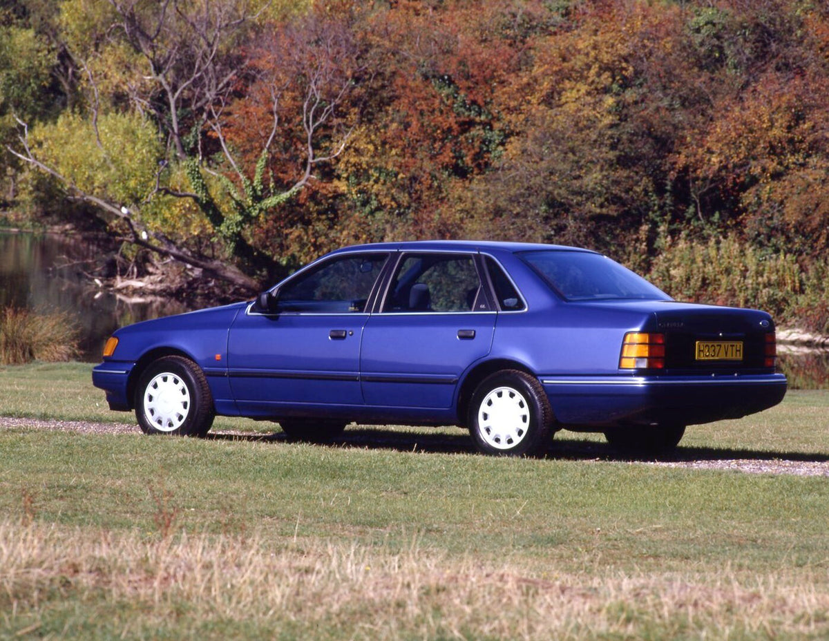 This archival image documents the 1990 Ford Granada Mark III GL rear view with scenic river and fall trees and is preserved in the Ford Heritage Vault as part of Ford Motor Company's historic photographic archive. Free for personal, non-commercial...