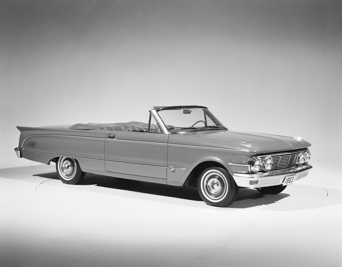 This archival image documents the 1963 Mercury Comet S-22 convertible Side Angle with Top Down and is preserved in the Ford Heritage Vault as part of Ford Motor Company's historic photographic archive. Free for personal, non-commercial use. Ford H...