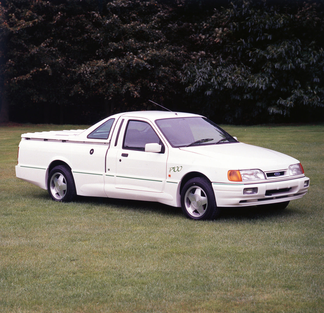 This archival image documents the 1988 Ford P-100 in scenic field with trees and is preserved in the Ford Heritage Vault as part of Ford Motor Company's historic photographic archive. Free for personal, non-commercial use. Ford Heritage Vault refe...