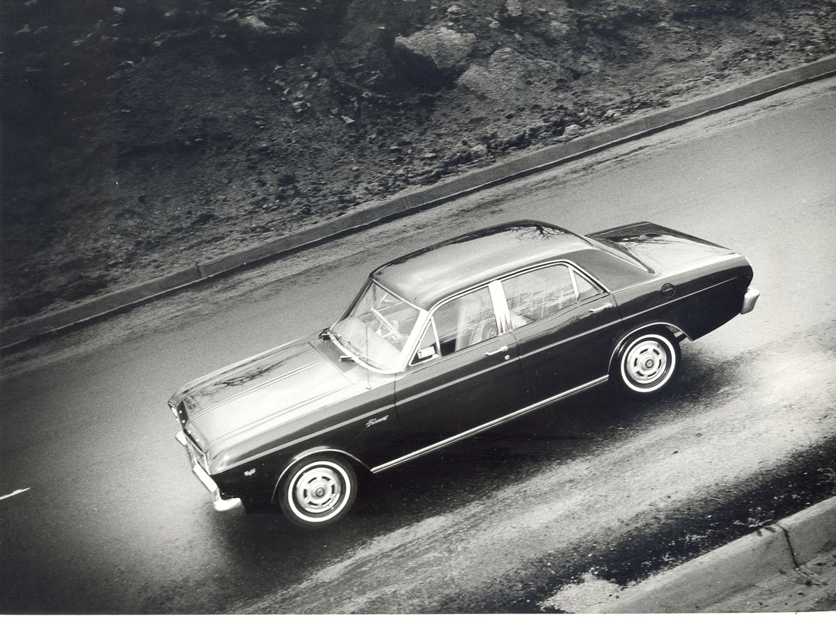 This archival image documents the 1966 Ford XR Falcon Fairmont aerial view on scenic road and is preserved in the Ford Heritage Vault as part of Ford Motor Company's historic photographic archive. Free for personal, non-commercial use. Ford Herita...