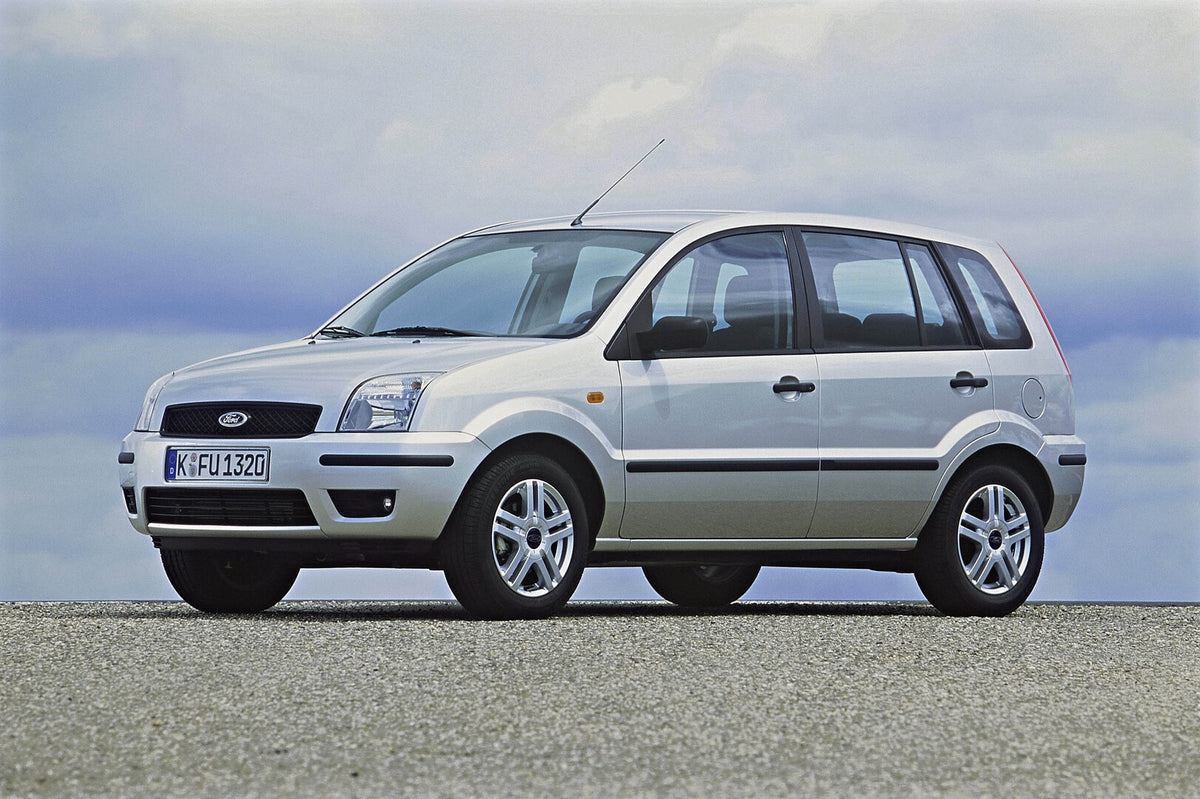 This archival image documents the 2002 Ford Fusion with scenic cloudy sky and is preserved in the Ford Heritage Vault as part of Ford Motor Company's historic photographic archive. Free for personal, non-commercial use. Ford Heritage Vault referen...
