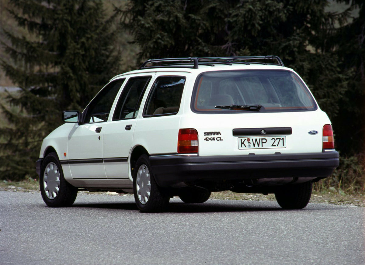 This archival image documents the 1989 Ford Sierra 4x4 CL rear view on scenic road with trees and is preserved in the Ford Heritage Vault as part of Ford Motor Company's historic photographic archive. Free for personal, non-commercial use. Ford He...