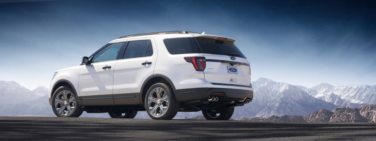 This archival image documents the 2018 Ford Explorer Sport rear view with scenic mountains MS and is preserved in the Ford Heritage Vault as part of Ford Motor Company's historic photographic archive. Free for personal, non-commercial use. Ford He...