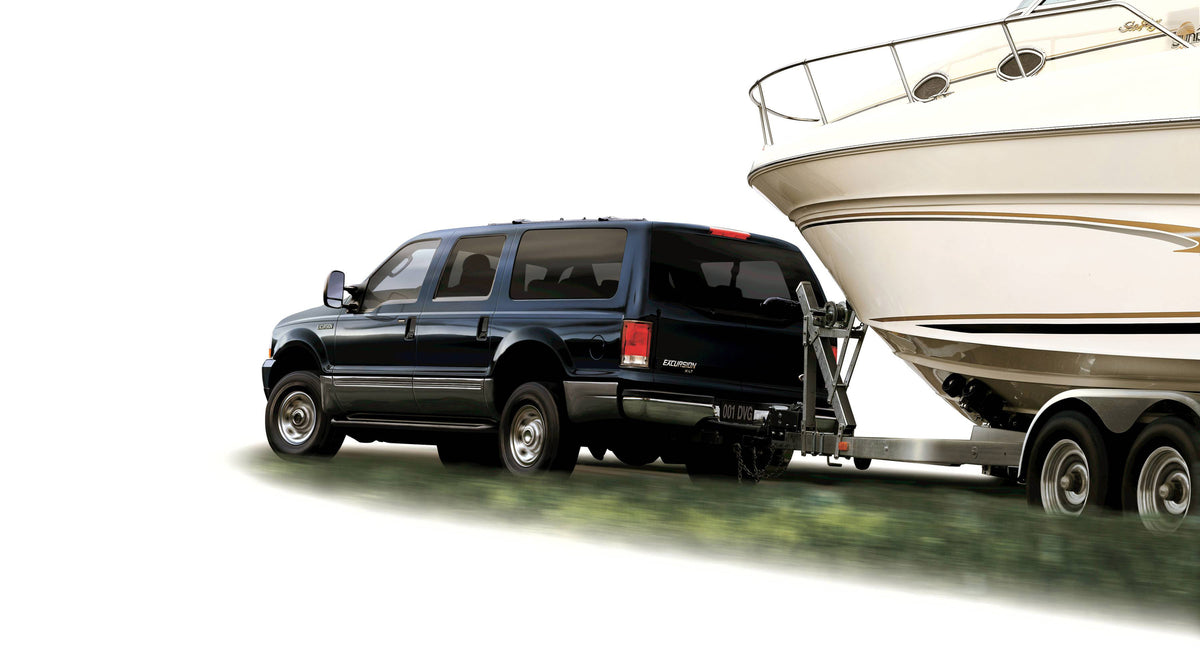 This archival image documents the 2005 Ford Excursion towing boat and is preserved in the Ford Heritage Vault as part of Ford Motor Company's historic photographic archive. Free for personal, non-commercial use. Ford Heritage Vault reference AR-20...