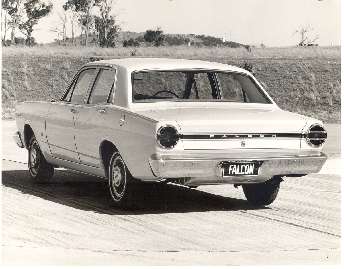 This archival image documents the 1968 Ford XT Falcon rear view on scenic road with trees and is preserved in the Ford Heritage Vault as part of Ford Motor Company's historic photographic archive. Free for personal, non-commercial use. Ford Herita...