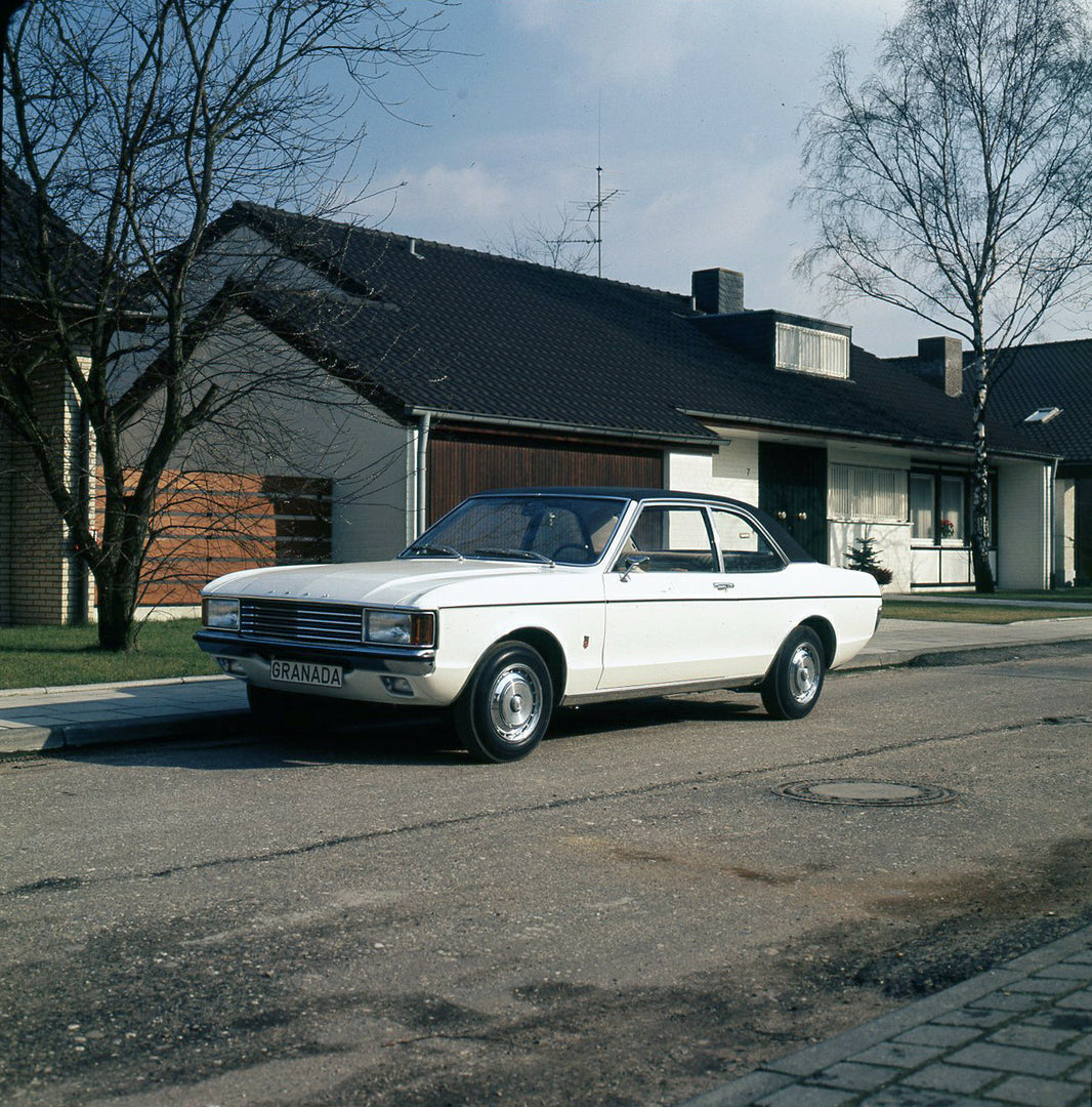 This archival image documents the 1973 Ford Granada Mark I in front of house and is preserved in the Ford Heritage Vault as part of Ford Motor Company's historic photographic archive. Free for personal, non-commercial use. Ford Heritage Vault refe...