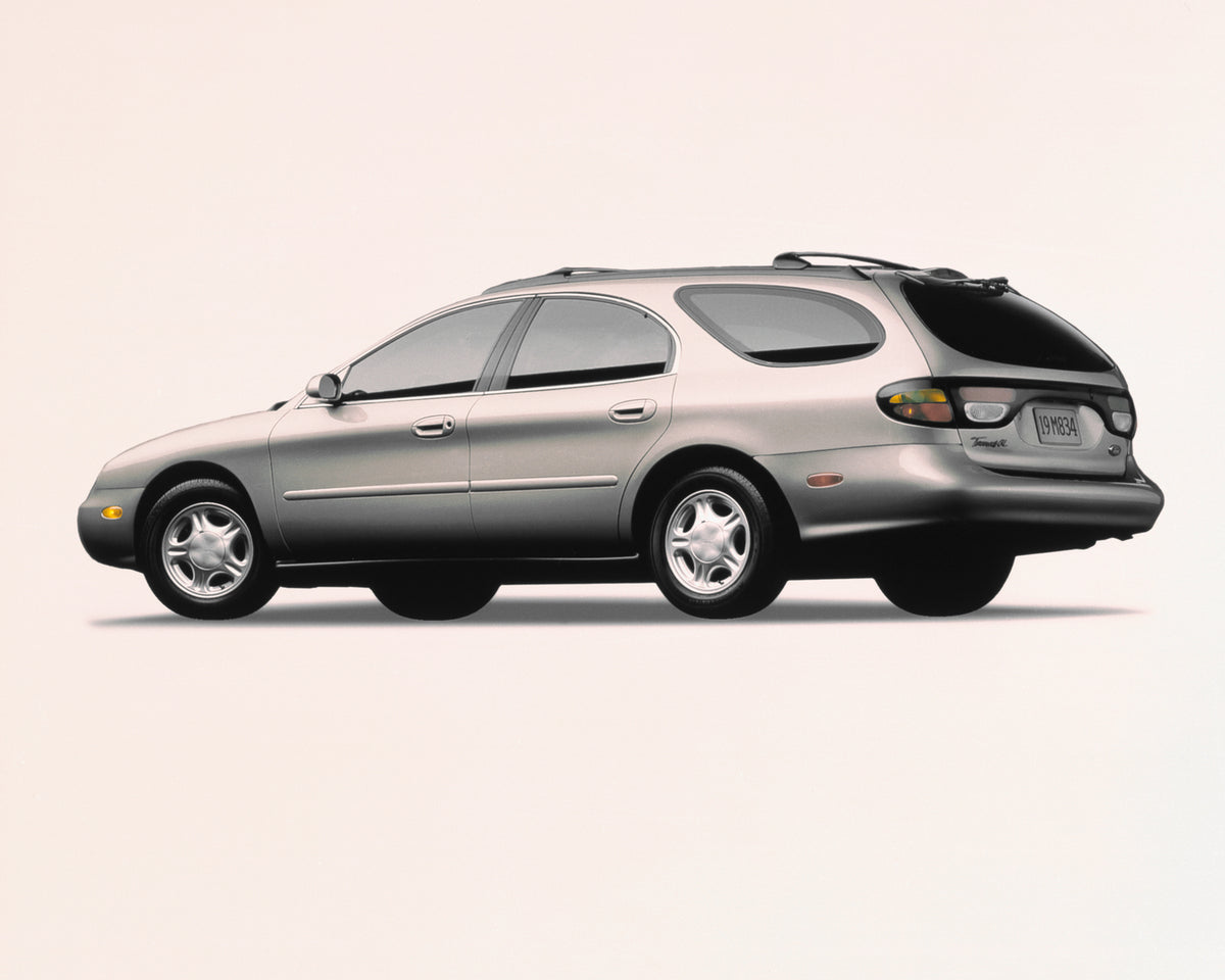 This archival image documents the 1996 Ford Taurus GL station wagon and is preserved in the Ford Heritage Vault as part of Ford Motor Company's historic photographic archive. Free for personal, non-commercial use. Ford Heritage Vault reference AR-...