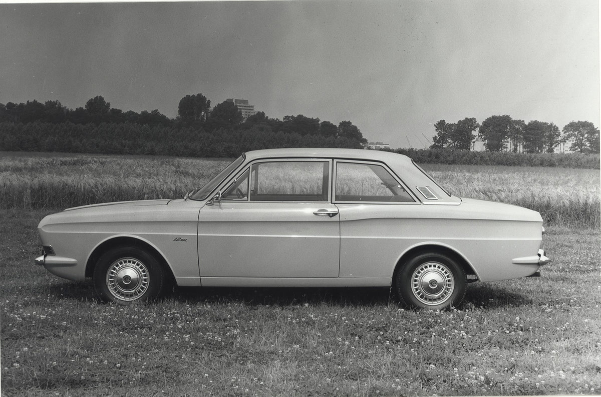 This archival image documents the 1968 Ford Taunus 12M P4 side view on scenic road and is preserved in the Ford Heritage Vault as part of Ford Motor Company's historic photographic archive. Free for personal, non-commercial use. Ford Heritage Vaul...