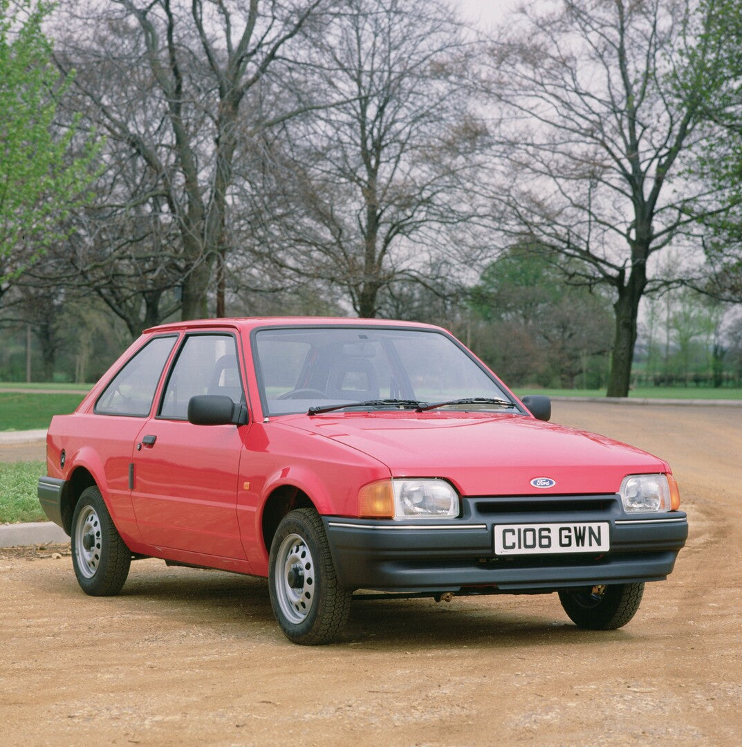 This archival image documents the 1986 Ford Escort MKIII front 3/4 view scenic 1986-346 and is preserved in the Ford Heritage Vault as part of Ford Motor Company's historic photographic archive. Free for personal, non-commercial use. Ford Heritage...