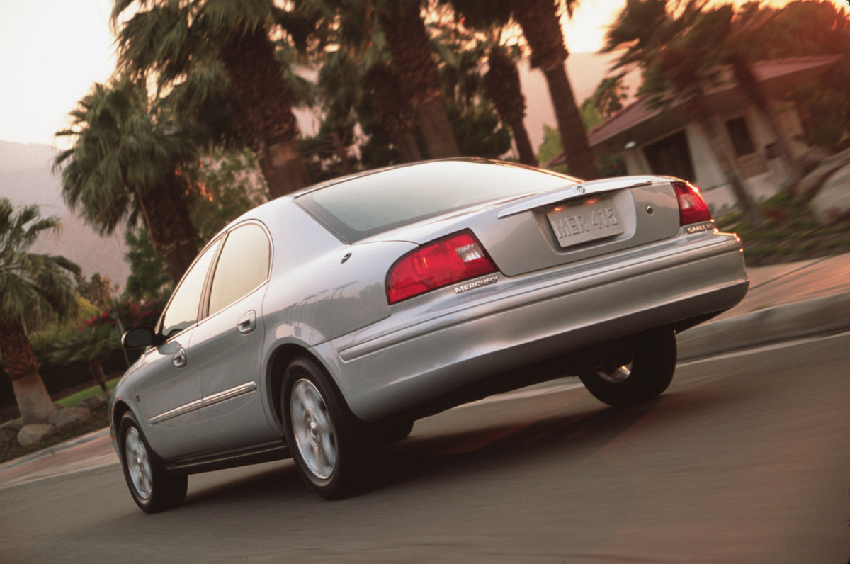 This archival image documents the 2003 Mercury Sable rear angle on road with palm trees CN336028-002 and is preserved in the Ford Heritage Vault as part of Ford Motor Company's historic photographic archive. Free for personal, non-commercial use. ...