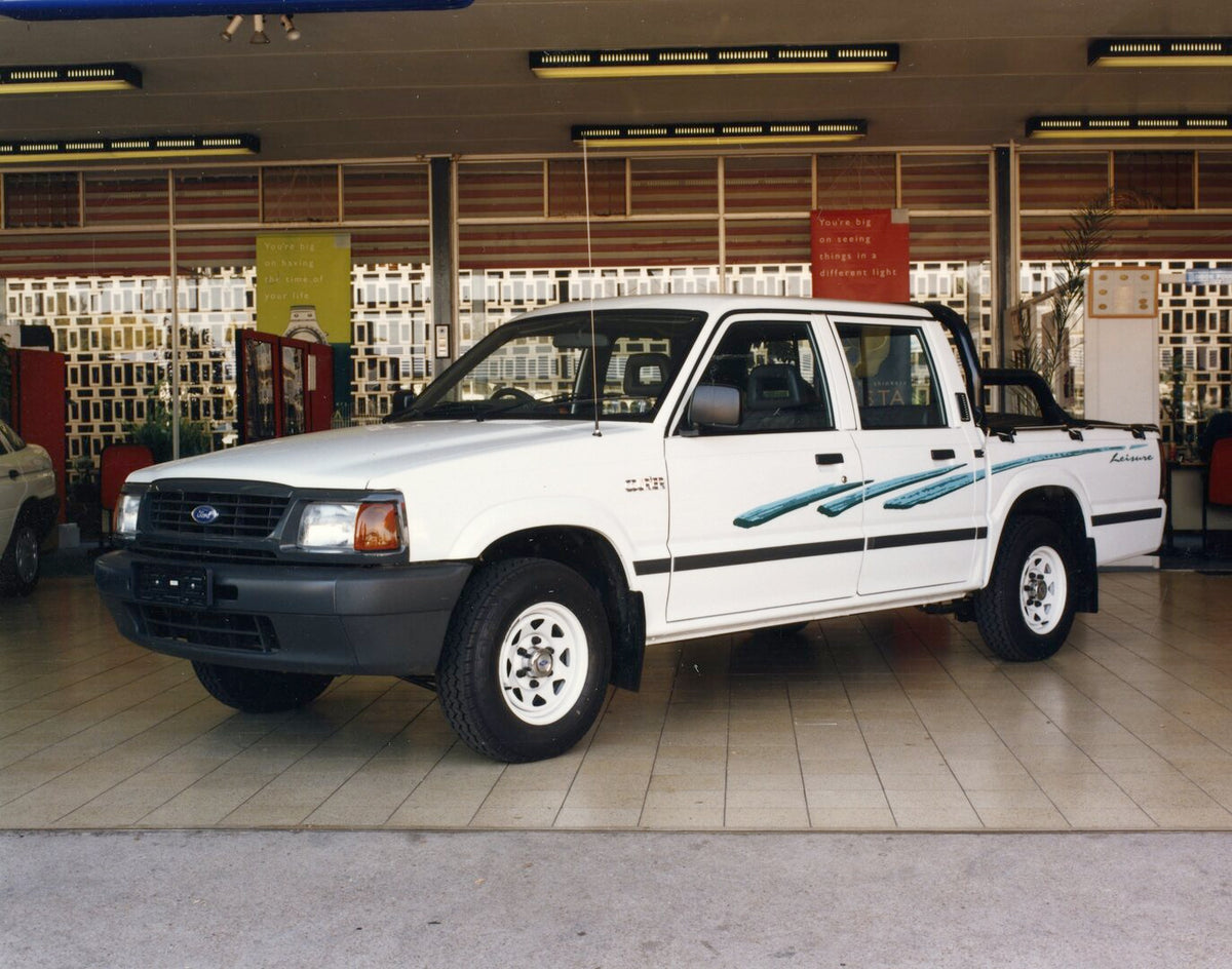 This archival image documents the 1998 Ford Courier Double Cab with Leisure Option Pack display AR-2002-210284.2.15.1 and is preserved in the Ford Heritage Vault as part of Ford Motor Company's historic photographic archive. Free for personal, non...