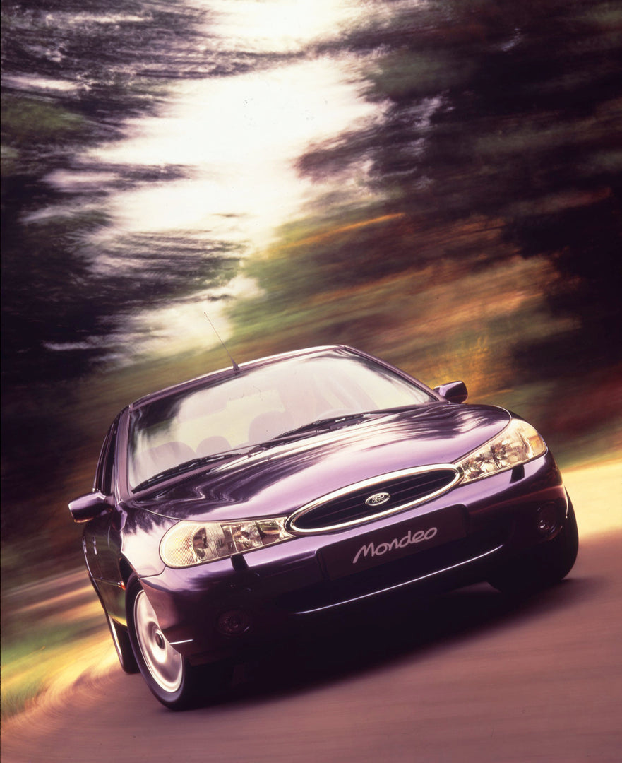 This archival image documents the 1997 Ford Mondeo Mark I with scenic trees and is preserved in the Ford Heritage Vault as part of Ford Motor Company's historic photographic archive. Free for personal, non-commercial use. Ford Heritage Vault refer...