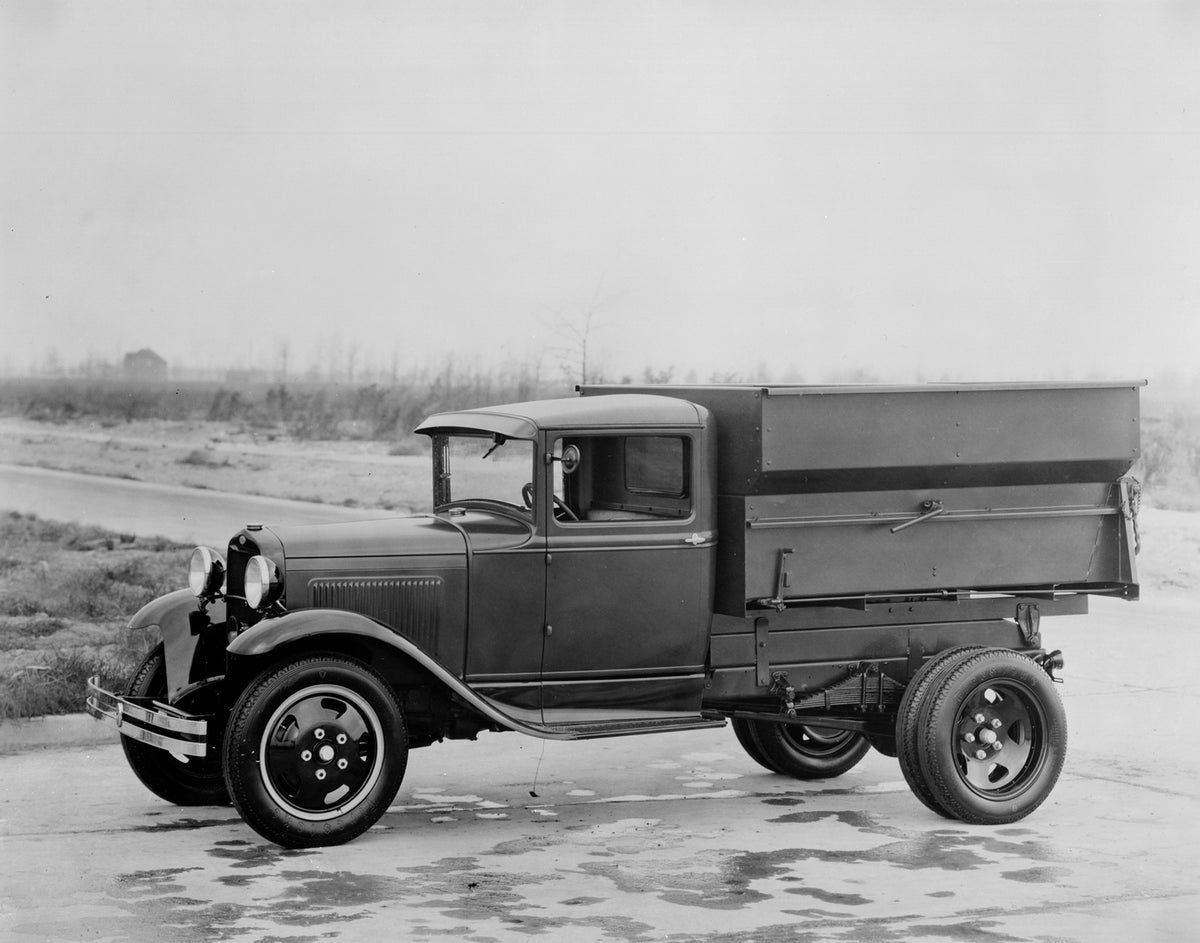 This archival image documents the 1930 Ford Model A dump truck and is preserved in the Ford Heritage Vault as part of Ford Motor Company's historic photographic archive. Free for personal, non-commercial use. Ford Heritage Vault reference AR-2008-...