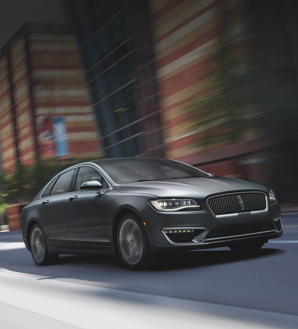 This archival image documents the 2023 Heritage Archive - 2015 Lincoln MKZ Hybrid action shot on city street FL7408517 and is preserved in the Ford Heritage Vault as part of Ford Motor Company's historic photographic archive. Free for personal, no...