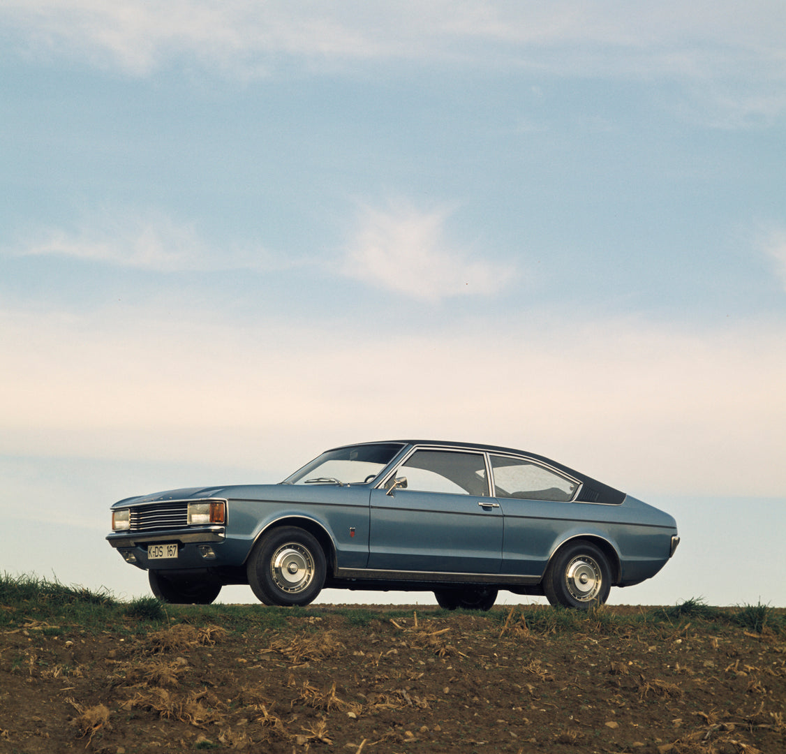 This archival image documents the 1974 Ford Granada Mark I low view in scenic field and is preserved in the Ford Heritage Vault as part of Ford Motor Company's historic photographic archive. Free for personal, non-commercial use. Ford Heritage Vau...