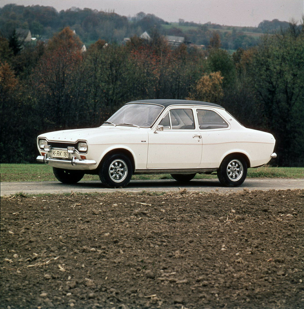 This archival image documents the 1974 Ford Escort Mark I GXL on scenic road with trees and is preserved in the Ford Heritage Vault as part of Ford Motor Company's historic photographic archive. Free for personal, non-commercial use. Ford Heritage...