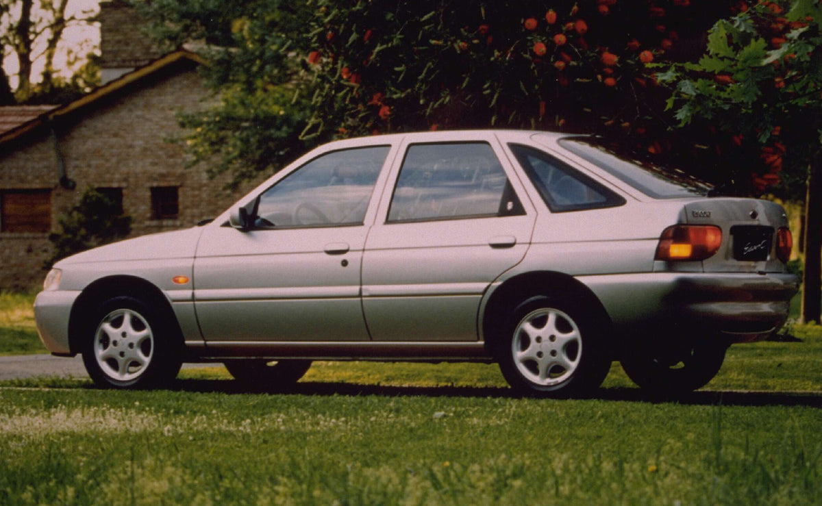 This archival image documents the 1997 Ford Escort Mark VI rear view with scenic trees AR-2002-213709 and is preserved in the Ford Heritage Vault as part of Ford Motor Company's historic photographic archive. Free for personal, non-commercial use....