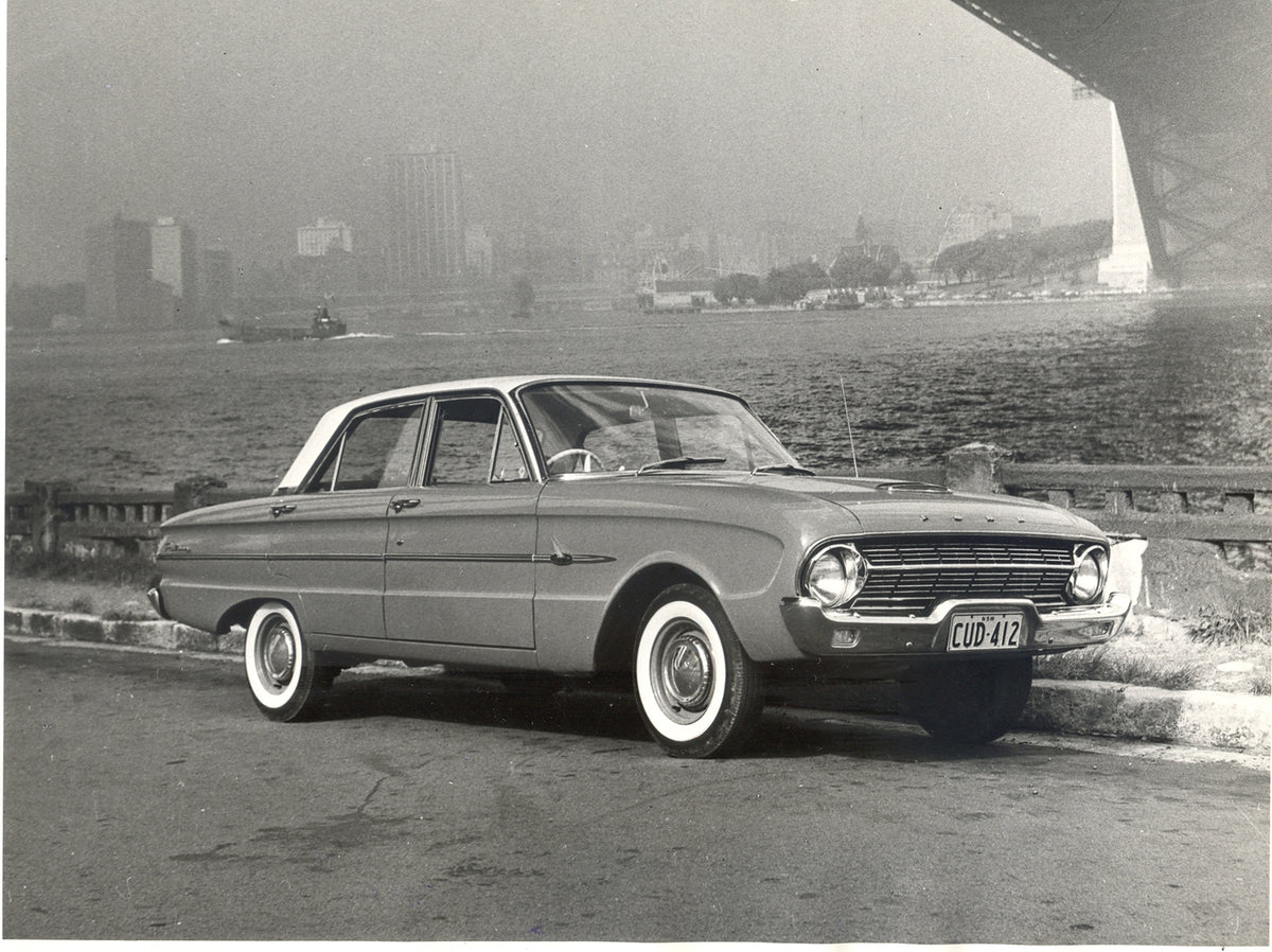 This archival image documents the 1962 Ford XL Falcon under scenic bridge with cityscape in background and is preserved in the Ford Heritage Vault as part of Ford Motor Company's historic photographic archive. Free for personal, non-commercial use...