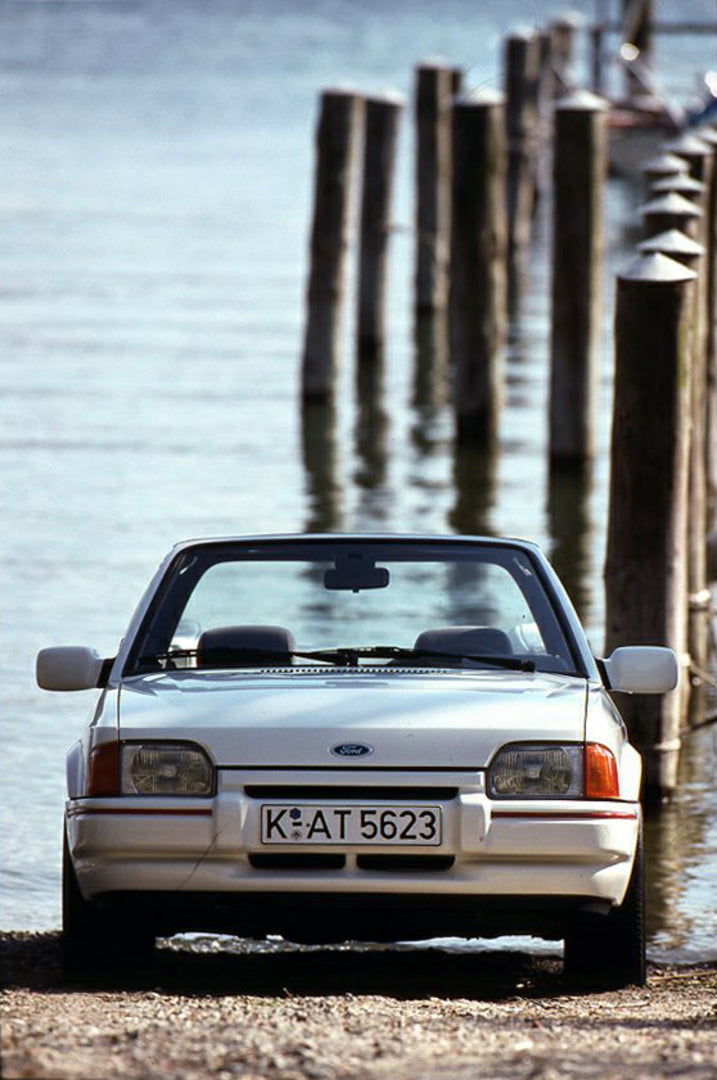 This archival image documents the 1989 Ford Escort Mark IV Cabriolet LHD on scenic beach vertical shot and is preserved in the Ford Heritage Vault as part of Ford Motor Company's historic photographic archive. Free for personal, non-commercial use...
