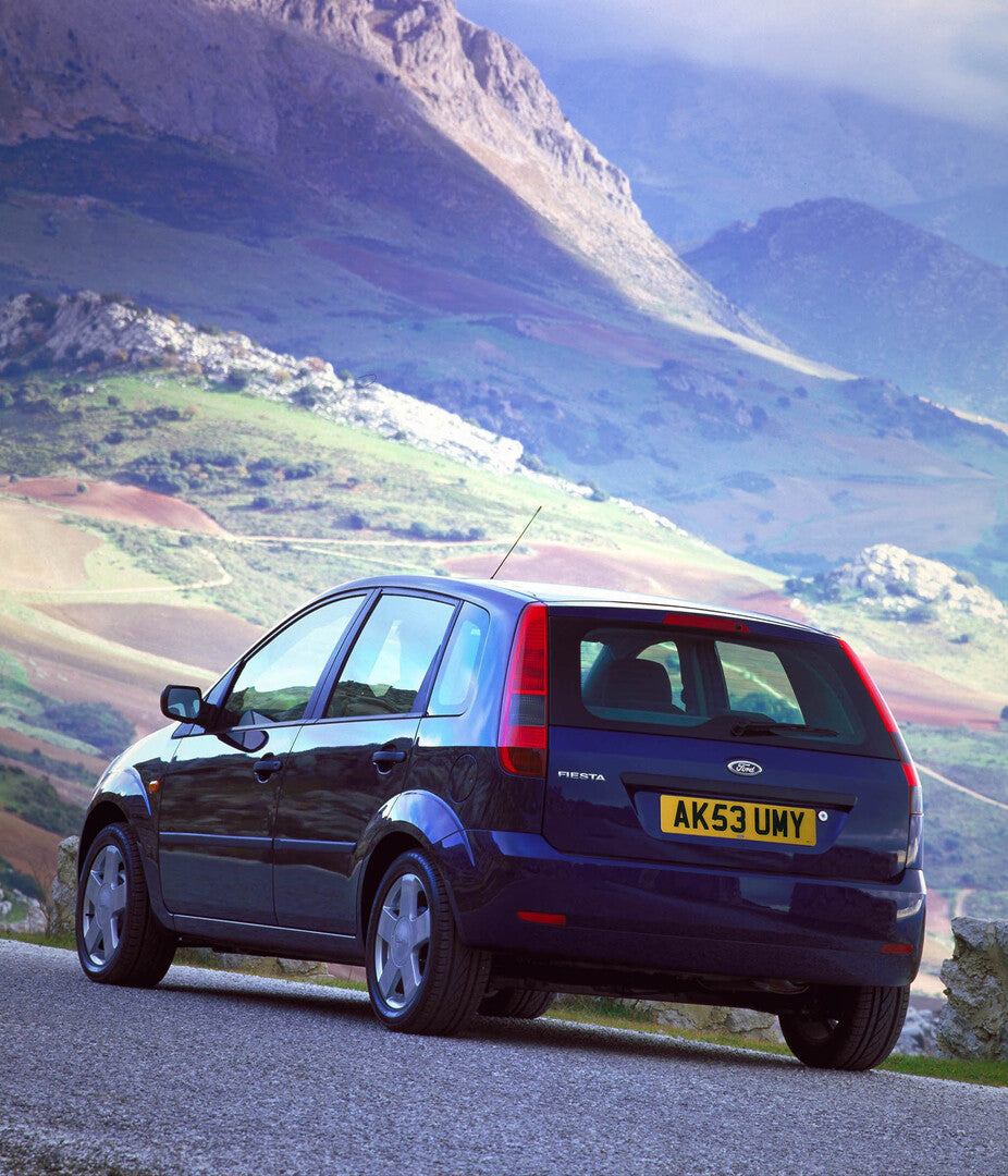 This archival image documents the 2003 Ford Fiesta Mark VI rear view with scenic mountains and is preserved in the Ford Heritage Vault as part of Ford Motor Company's historic photographic archive. Free for personal, non-commercial use. Ford Herit...