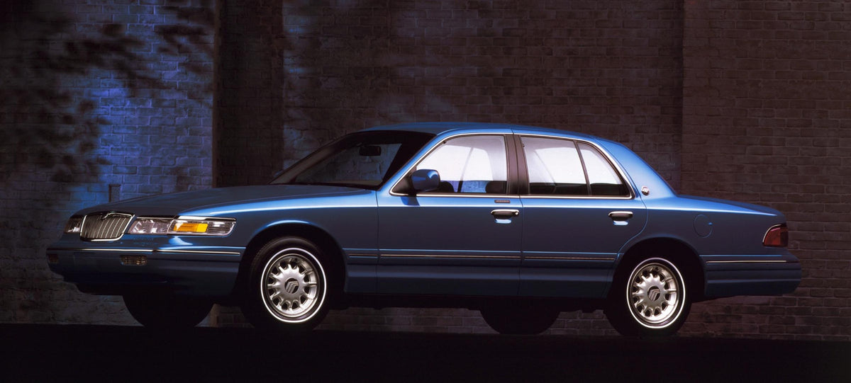 This archival image documents the 1996 Mercury Grand Marquis driver side with shadowy background and is preserved in the Ford Heritage Vault as part of Ford Motor Company's historic photographic archive. Free for personal, non-commercial use. Ford...