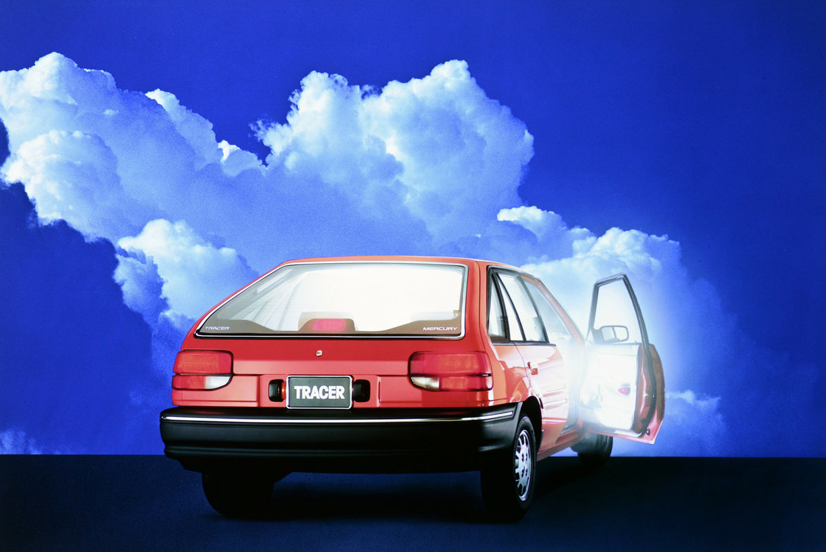 This archival image documents the 1989 Mercury Tracer four-door and is preserved in the Ford Heritage Vault as part of Ford Motor Company's historic photographic archive. Free for personal, non-commercial use. Ford Heritage Vault reference AR-2001...