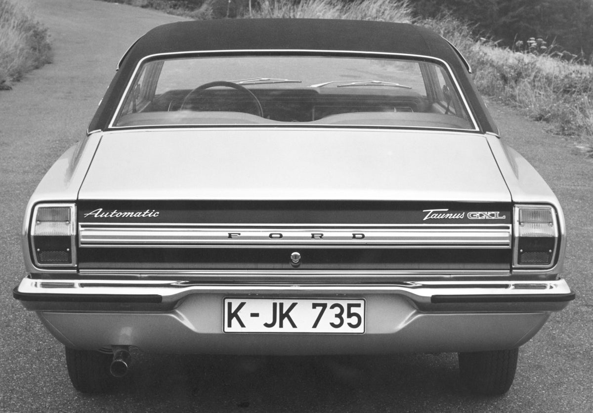 This archival image documents the 1973 Ford Taunus GXL rear closeup on scenic road and is preserved in the Ford Heritage Vault as part of Ford Motor Company's historic photographic archive. Free for personal, non-commercial use. Ford Heritage Vaul...