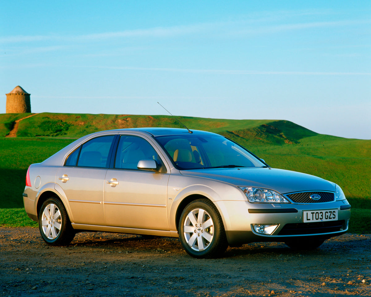 This archival image documents the 2003 Ford Mondeo Mark II with scenic farm landscape and is preserved in the Ford Heritage Vault as part of Ford Motor Company's historic photographic archive. Free for personal, non-commercial use. Ford Heritage V...