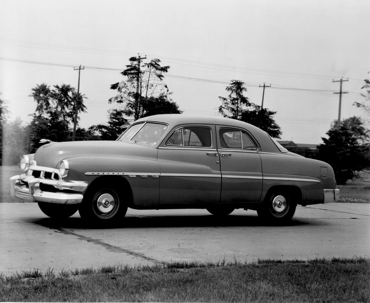This archival image documents the 1951 Monarch Sedan on scenic road with trees AR-2007-5 and is preserved in the Ford Heritage Vault as part of Ford Motor Company's historic photographic archive. Free for personal, non-commercial use. Ford Heritag...