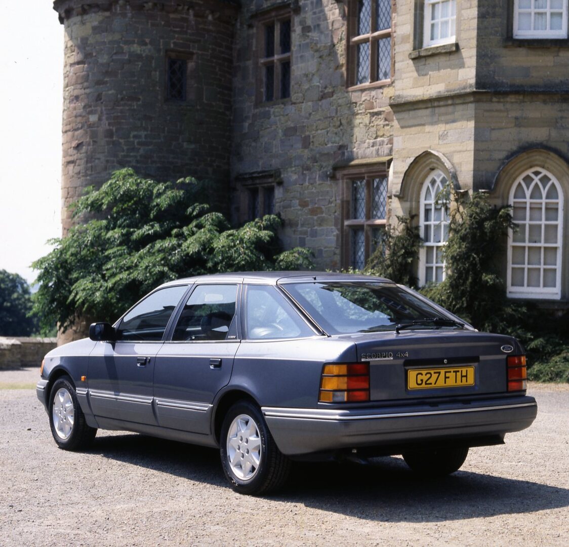 This archival image documents the 1989 Ford Granada Scorpio MK I 4x4 rear view at scenic castle and is preserved in the Ford Heritage Vault as part of Ford Motor Company's historic photographic archive. Free for personal, non-commercial use. Ford ...