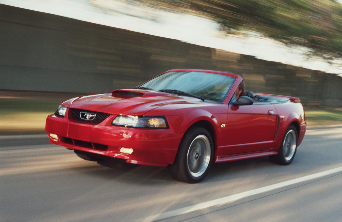 This archival image documents the 2002 Ford Mustang GT Premium convertible and is preserved in the Ford Heritage Vault as part of Ford Motor Company's historic photographic archive. Free for personal, non-commercial use. Ford Heritage Vault refere...