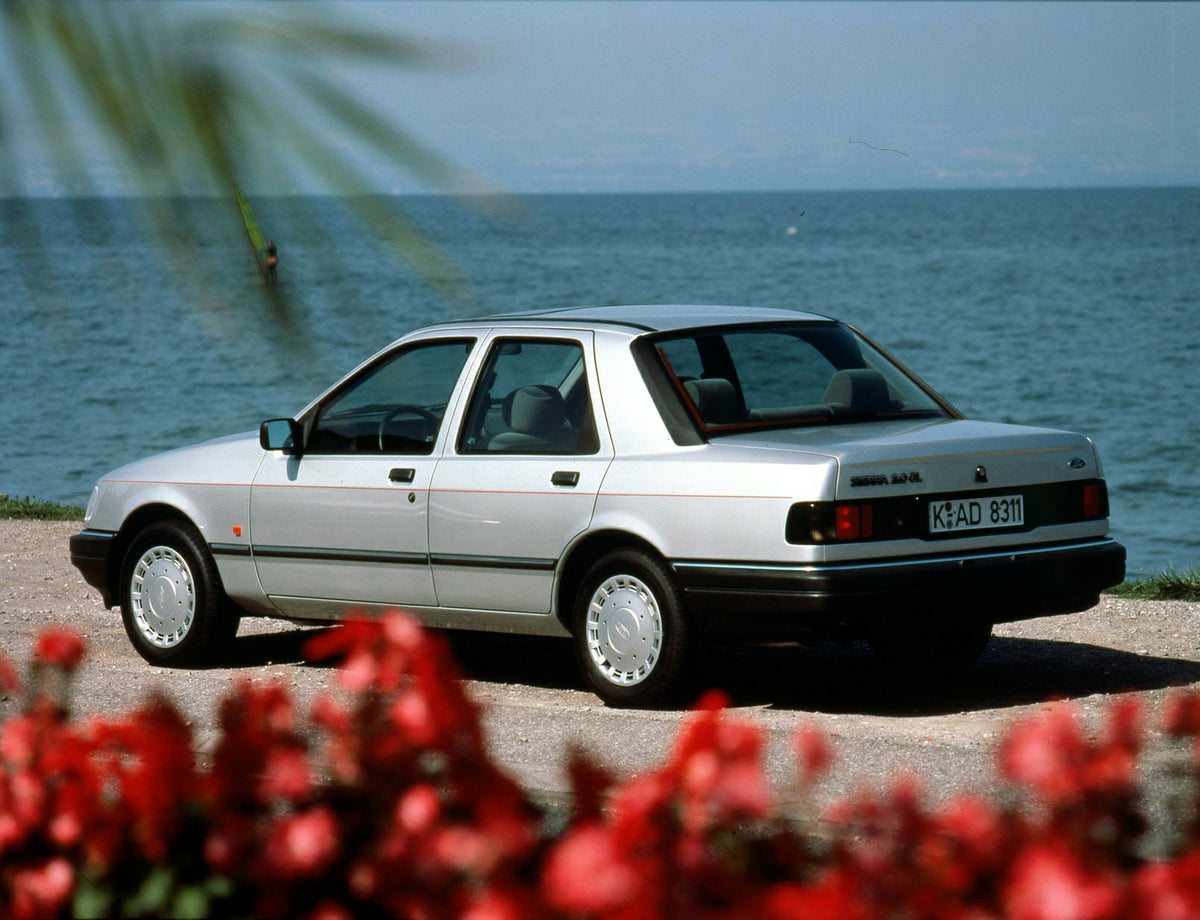 This archival image documents the 1989 Ford Sierra 2.0 CL rear view with scenic flowers and body of water and is preserved in the Ford Heritage Vault as part of Ford Motor Company's historic photographic archive. Free for personal, non-commercial ...