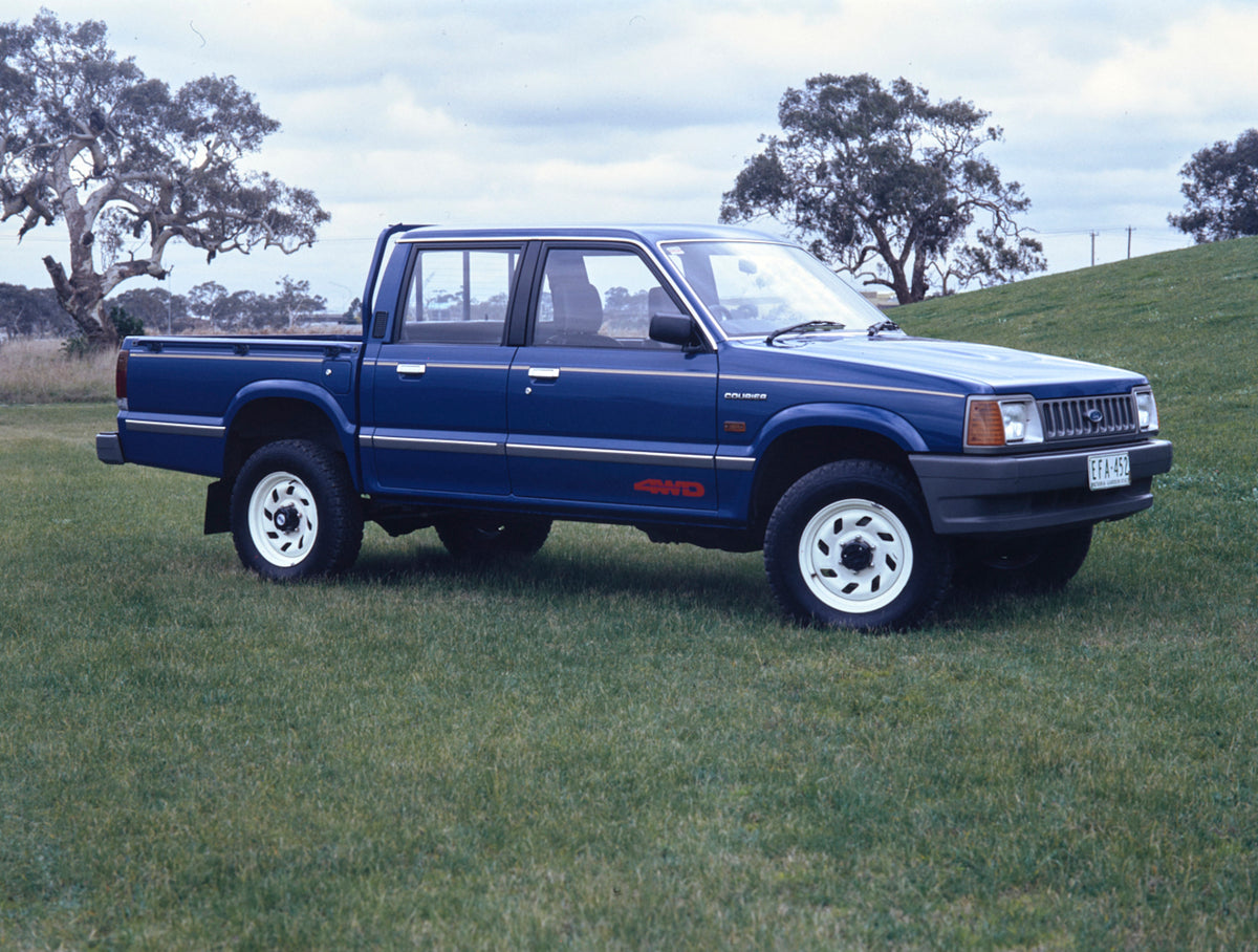 This archival image documents the 1991 Ford Courier 4WD Pickup Truck Driver Side Front End View in a Field FAP-2011-3 and is preserved in the Ford Heritage Vault as part of Ford Motor Company's historic photographic archive. Free for personal, non...