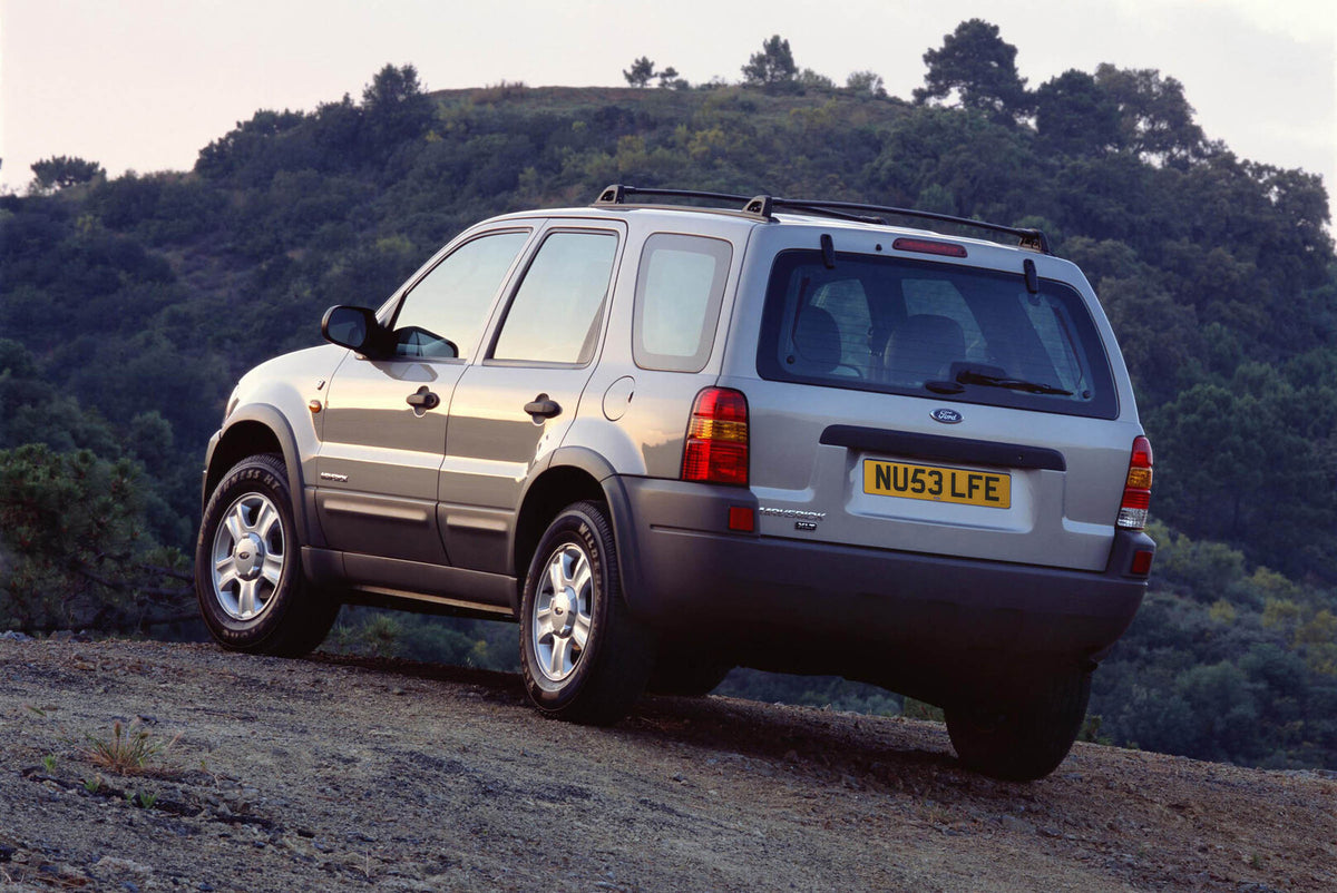This archival image documents the 2003 Ford Maverick rear view on scenic hill and is preserved in the Ford Heritage Vault as part of Ford Motor Company's historic photographic archive. Free for personal, non-commercial use. Ford Heritage Vault ref...