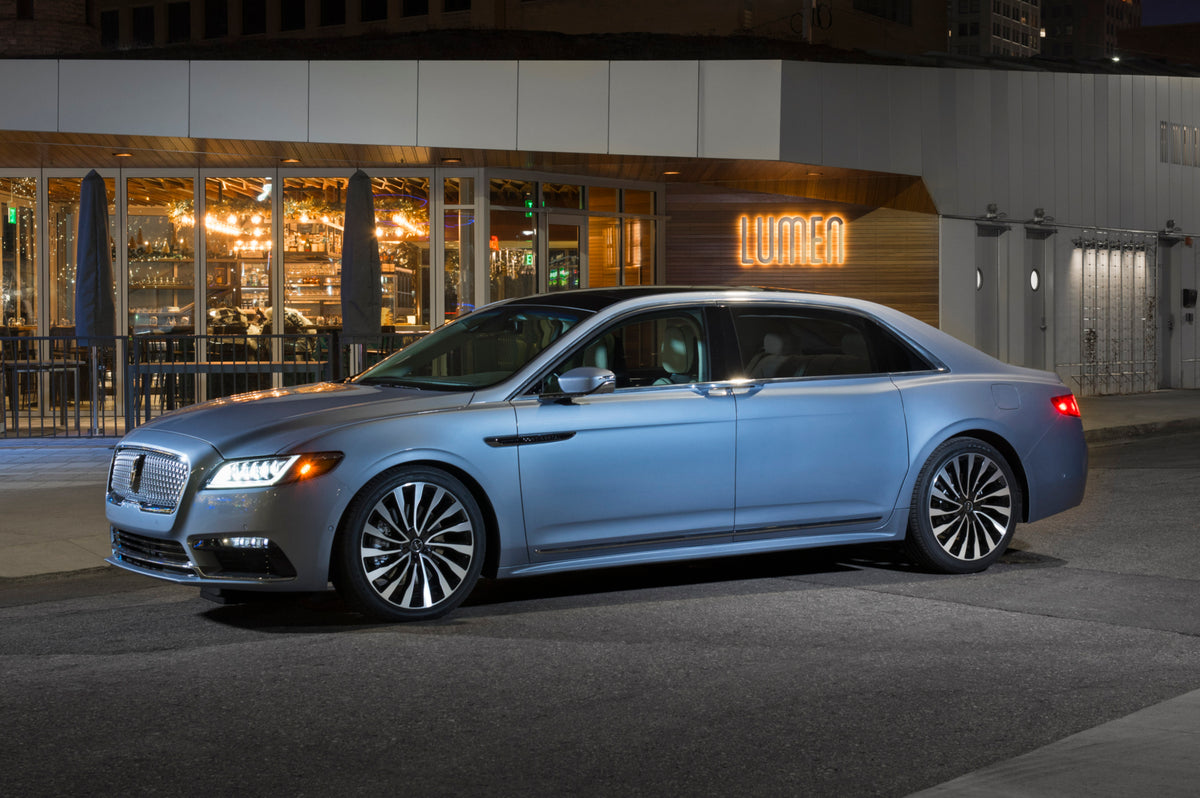 This archival image documents the 2019 Lincoln Continental with coach doors in front of restaurant at night and is preserved in the Ford Heritage Vault as part of Ford Motor Company's historic photographic archive. Free for personal, non-commercia...