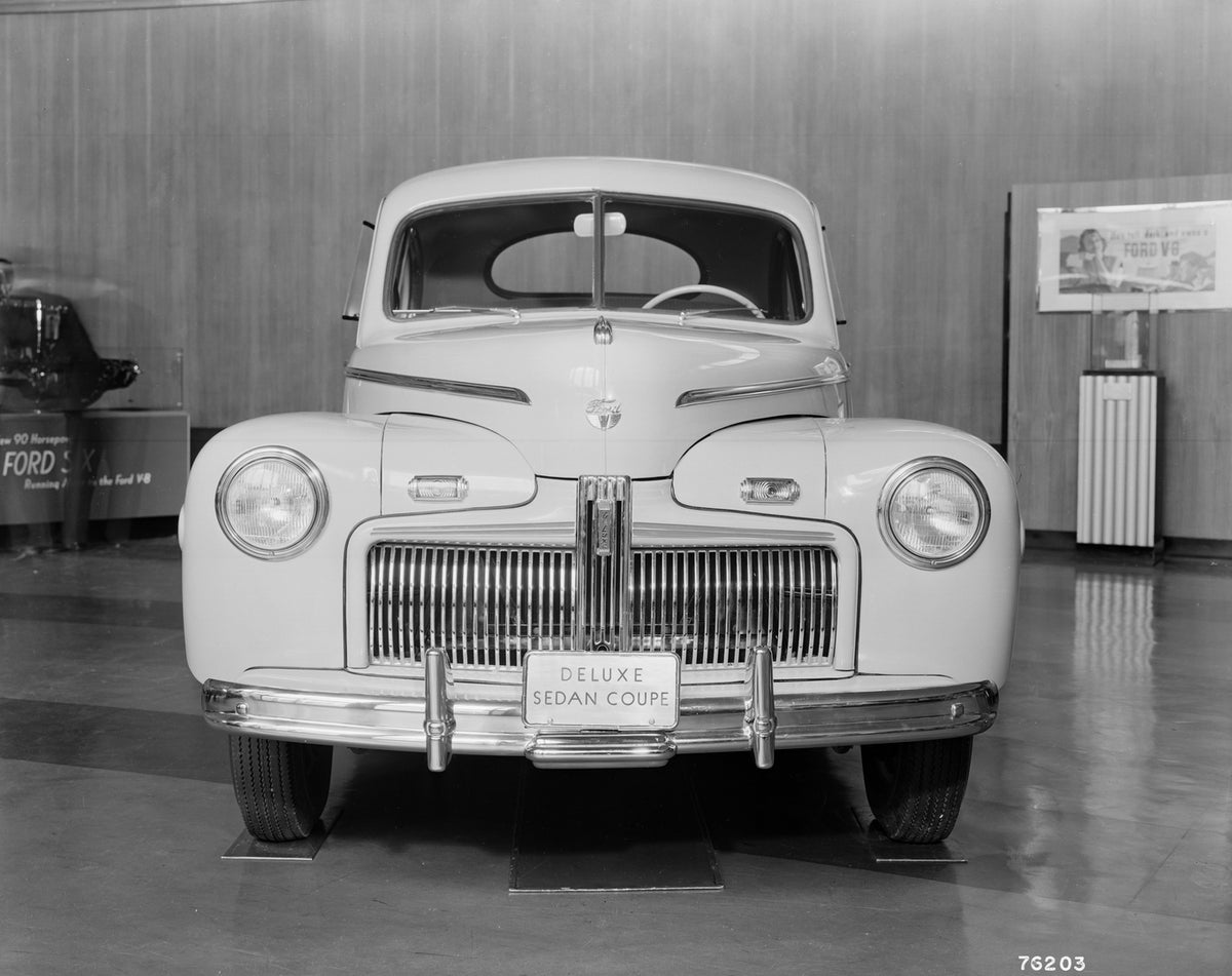 This archival image documents the 1942 Ford DeLuxe coupe sedan and is preserved in the Ford Heritage Vault as part of Ford Motor Company's historic photographic archive. Free for personal, non-commercial use. Ford Heritage Vault reference AR-2008-...