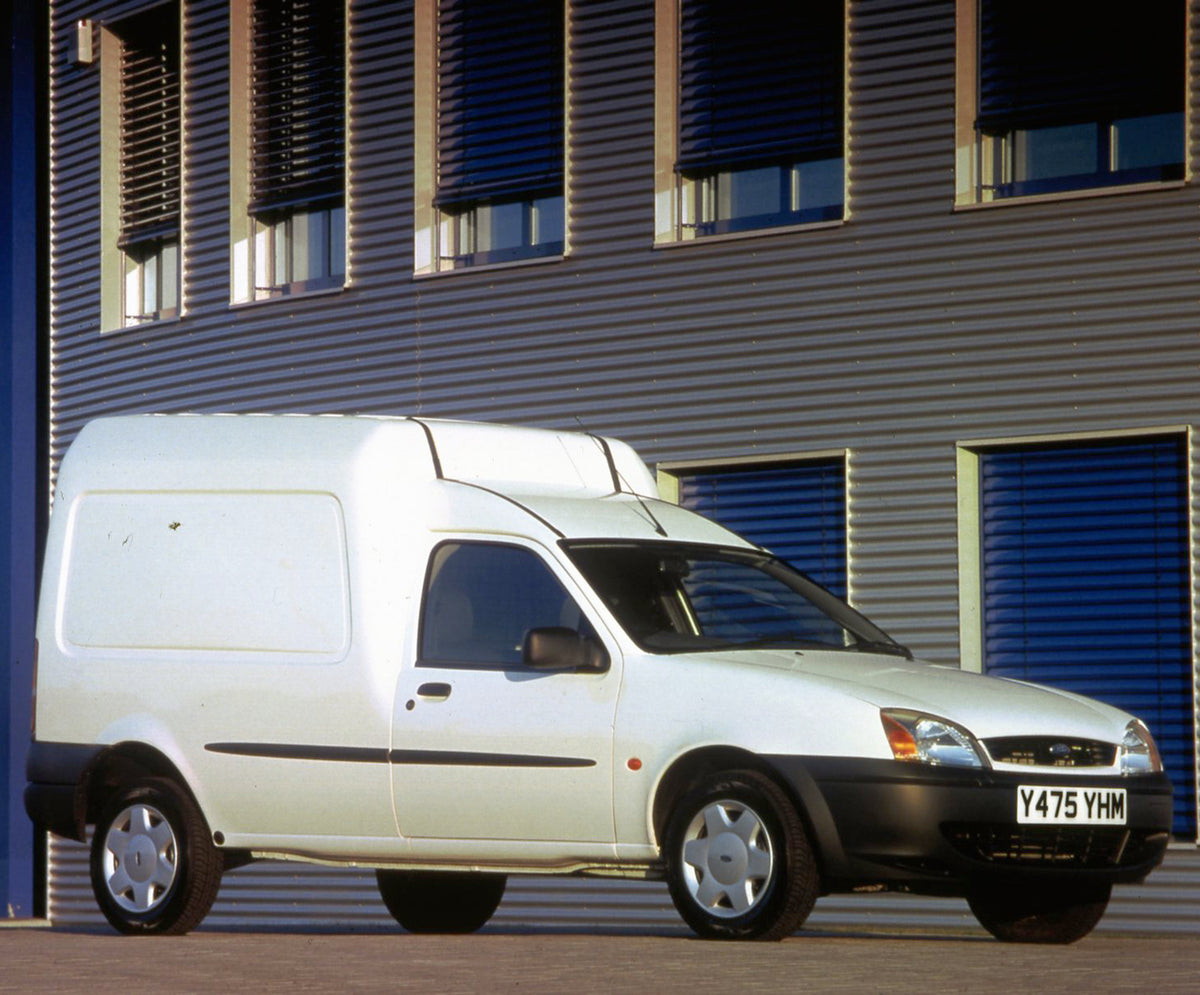 This archival image documents the 2001 Ford Courier van in front of scenic building and is preserved in the Ford Heritage Vault as part of Ford Motor Company's historic photographic archive. Free for personal, non-commercial use. Ford Heritage Vau...