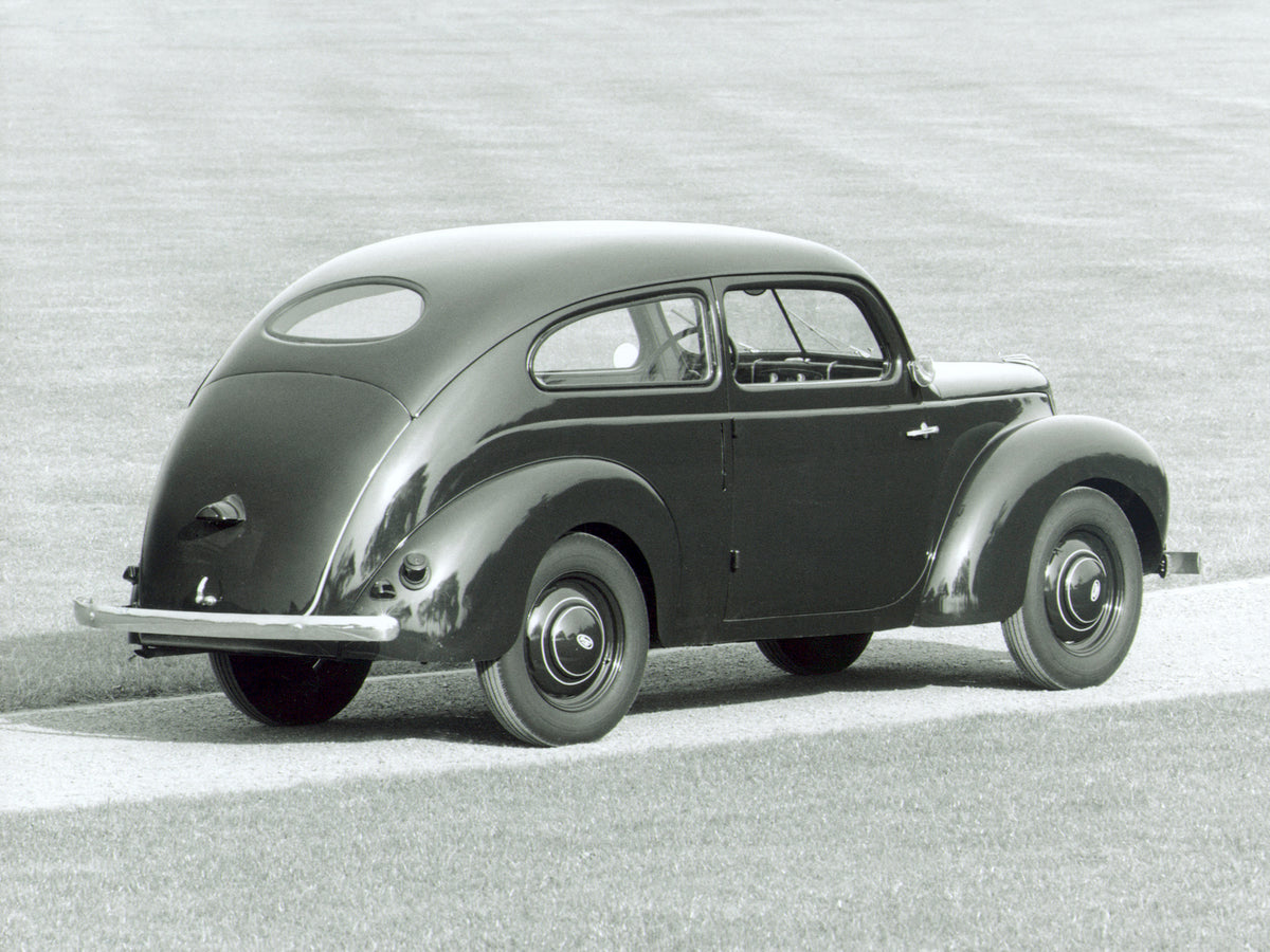 This archival image documents the 1939 Ford Taunus G93A rear view on scenic road and is preserved in the Ford Heritage Vault as part of Ford Motor Company's historic photographic archive. Free for personal, non-commercial use. Ford Heritage Vault ...