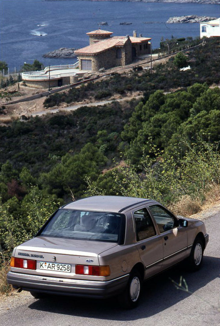 This archival image documents the 1986 Heritage Archive - 1987 1/2 Ford Sierra rear view on scenic road in Spain and is preserved in the Ford Heritage Vault as part of Ford Motor Company's historic photographic archive. Free for personal, non-comm...