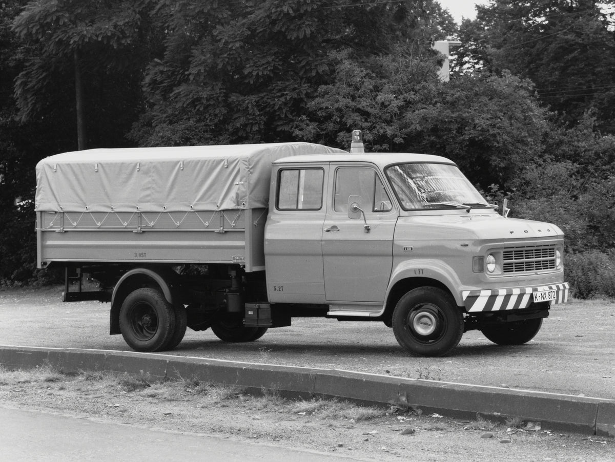 This archival image documents the 1970 Ford A-Series Truck on dirt road with scenic trees and is preserved in the Ford Heritage Vault as part of Ford Motor Company's historic photographic archive. Free for personal, non-commercial use. Ford Herita...