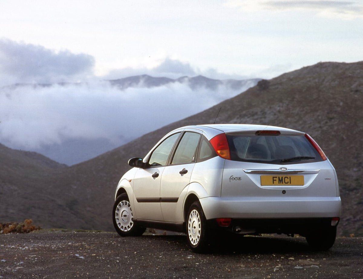 This archival image documents the 2001 Ford Focus Mark I rear view in mountains with scenic fog and is preserved in the Ford Heritage Vault as part of Ford Motor Company's historic photographic archive. Free for personal, non-commercial use. Ford ...