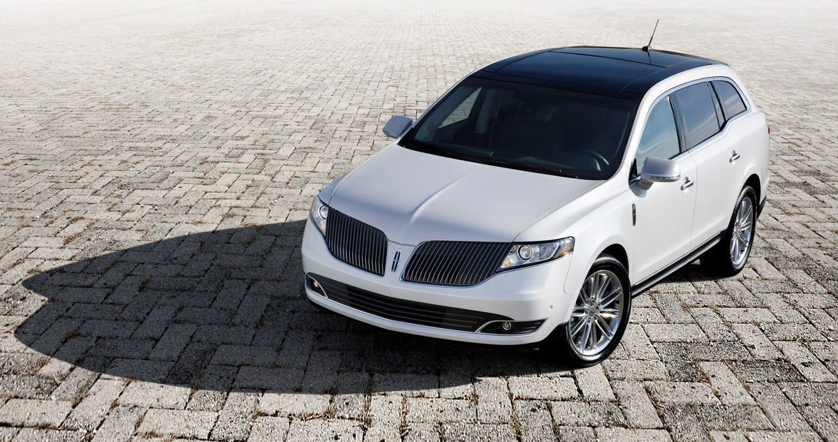 This archival image documents the 2013 Lincoln MKT on brick road MS52867 and is preserved in the Ford Heritage Vault as part of Ford Motor Company's historic photographic archive. Free for personal, non-commercial use. Ford Heritage Vault referenc...