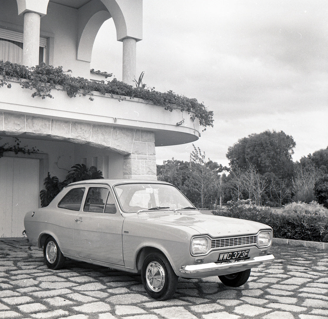 This archival image documents the 1967 Ford Escort Mark I Super closeup in driveway of scenic house in Portugal and is preserved in the Ford Heritage Vault as part of Ford Motor Company's historic photographic archive. Free for personal, non-comme...