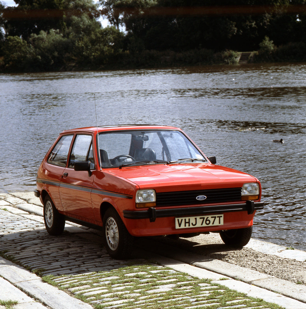 This archival image documents the 1978 Ford Fiesta Mark I 1.1 S near scenic lake with trees and is preserved in the Ford Heritage Vault as part of Ford Motor Company's historic photographic archive. Free for personal, non-commercial use. Ford Heri...