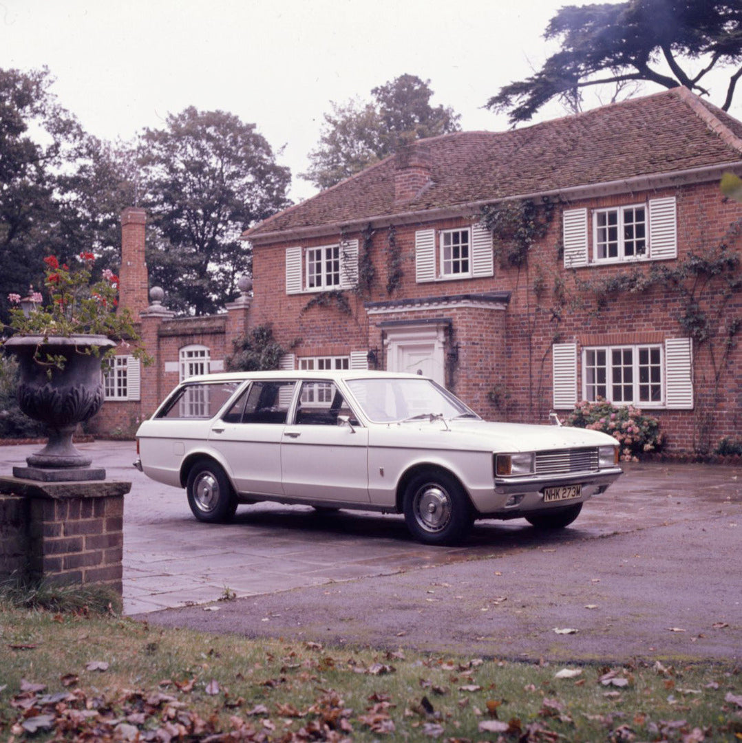 This archival image documents the 1973 Ford Granada Mark I Estate in driveway of scenic house and is preserved in the Ford Heritage Vault as part of Ford Motor Company's historic photographic archive. Free for personal, non-commercial use. Ford He...