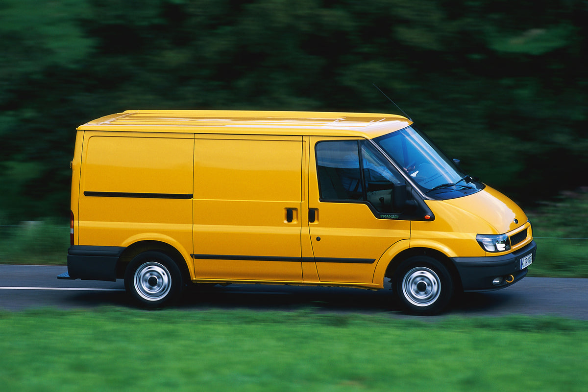 This archival image documents the 2000 Ford Transit Mark VI FWD action shot on scenic road with trees and is preserved in the Ford Heritage Vault as part of Ford Motor Company's historic photographic archive. Free for personal, non-commercial use....