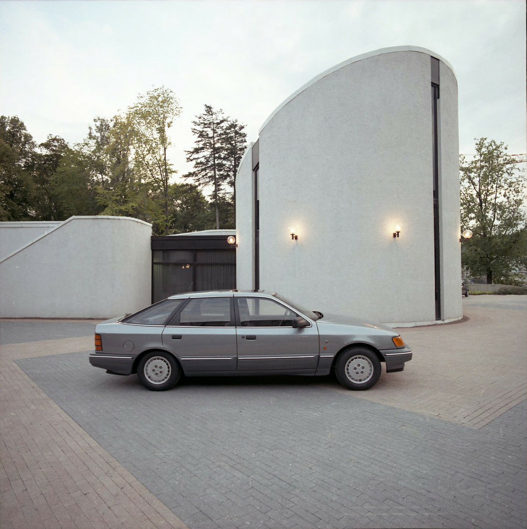 This archival image documents the 1986 Ford Granada Mark III Ghia side view in front of scenic building in Norway and is preserved in the Ford Heritage Vault as part of Ford Motor Company's historic photographic archive. Free for personal, non-com...