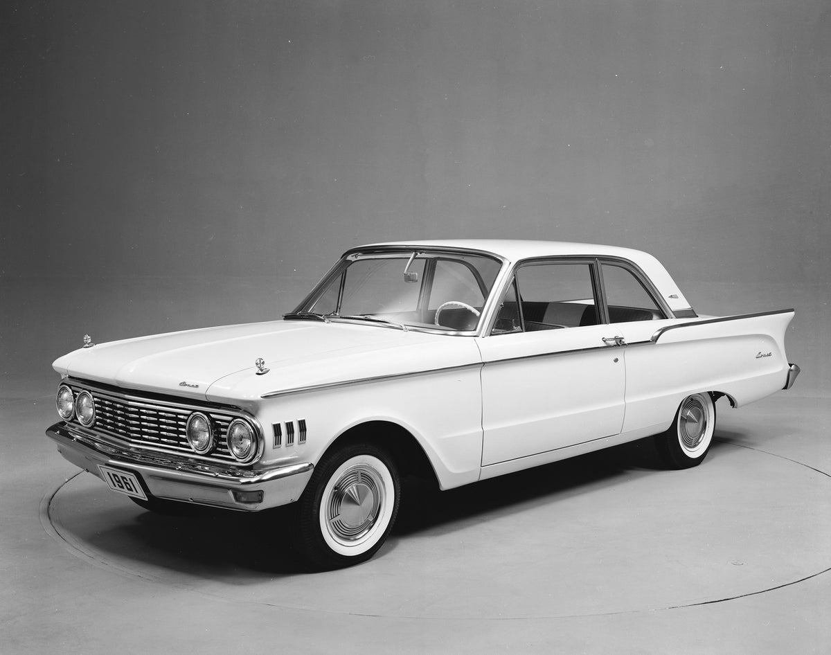 This archival image documents the 1961 Mercury Comet two-door sedan and is preserved in the Ford Heritage Vault as part of Ford Motor Company's historic photographic archive. Free for personal, non-commercial use. Ford Heritage Vault reference AR-...