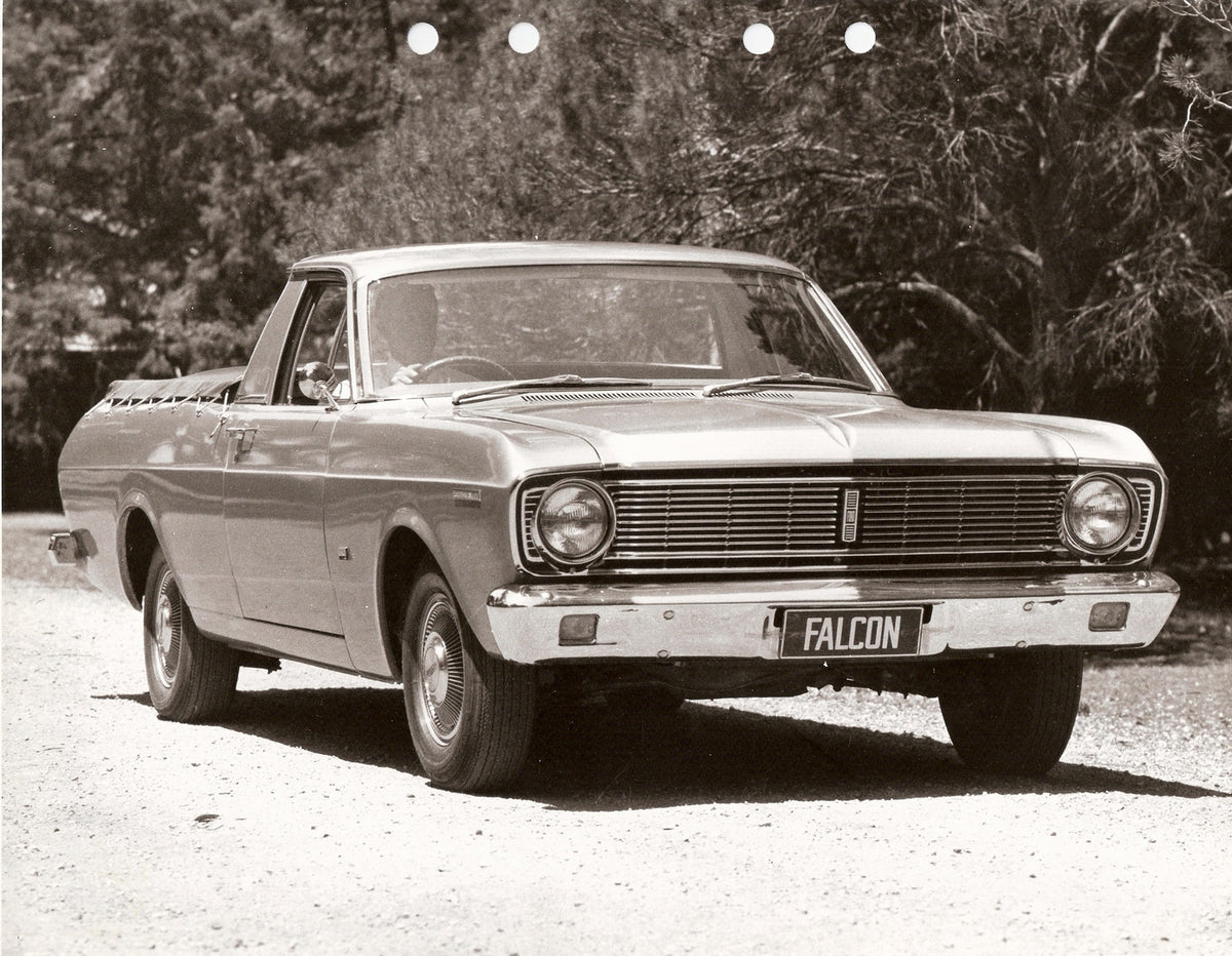 This archival image documents the 1968 Ford XT Falcon Ute on scenic road with trees and is preserved in the Ford Heritage Vault as part of Ford Motor Company's historic photographic archive. Free for personal, non-commercial use. Ford Heritage Vau...