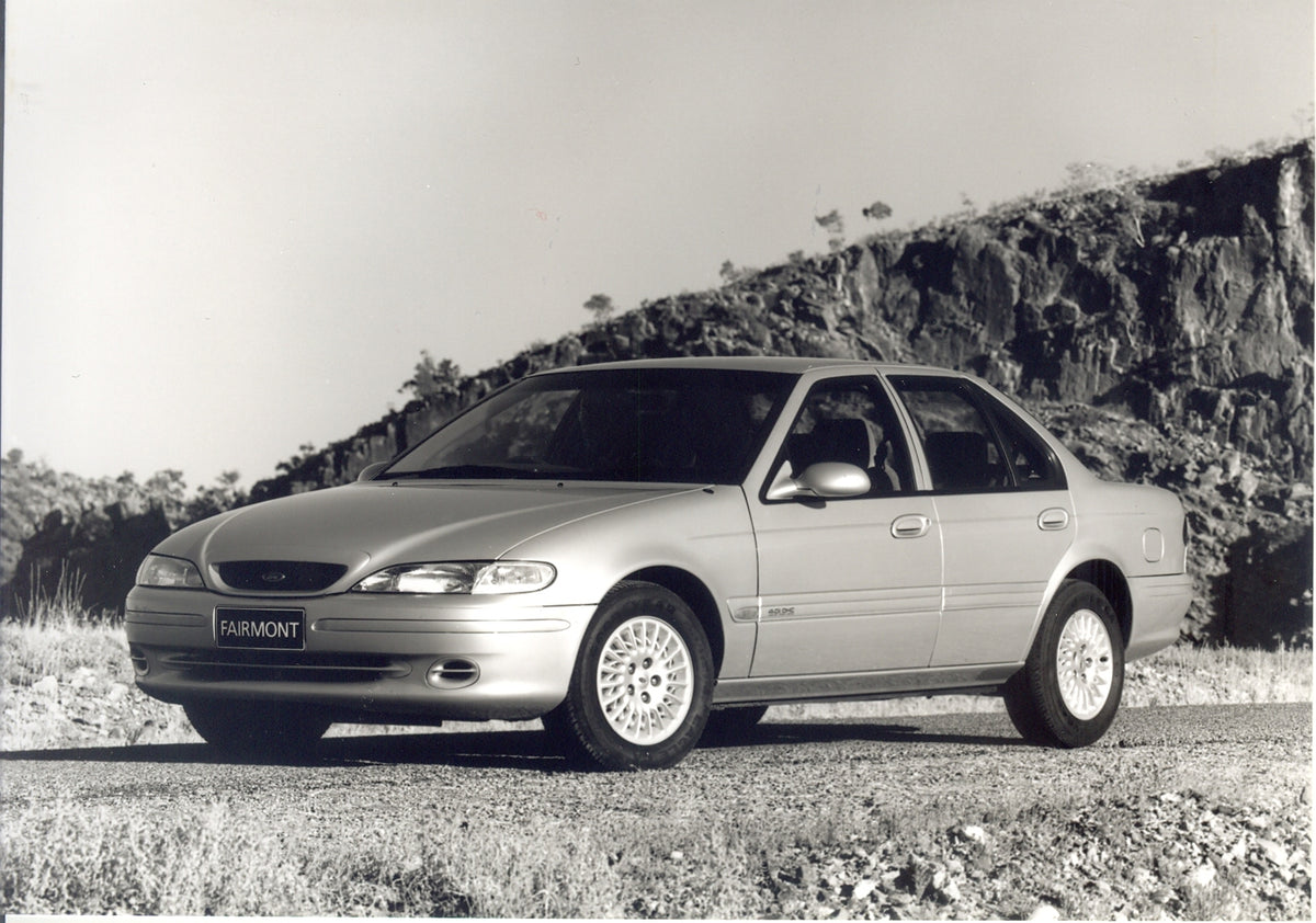 This archival image documents the 1994 Ford Falcon EF Fairmont with scenic rock formation and is preserved in the Ford Heritage Vault as part of Ford Motor Company's historic photographic archive. Free for personal, non-commercial use. Ford Herita...